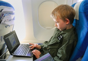 Tuomas playing a game on the flight back to Helsinki